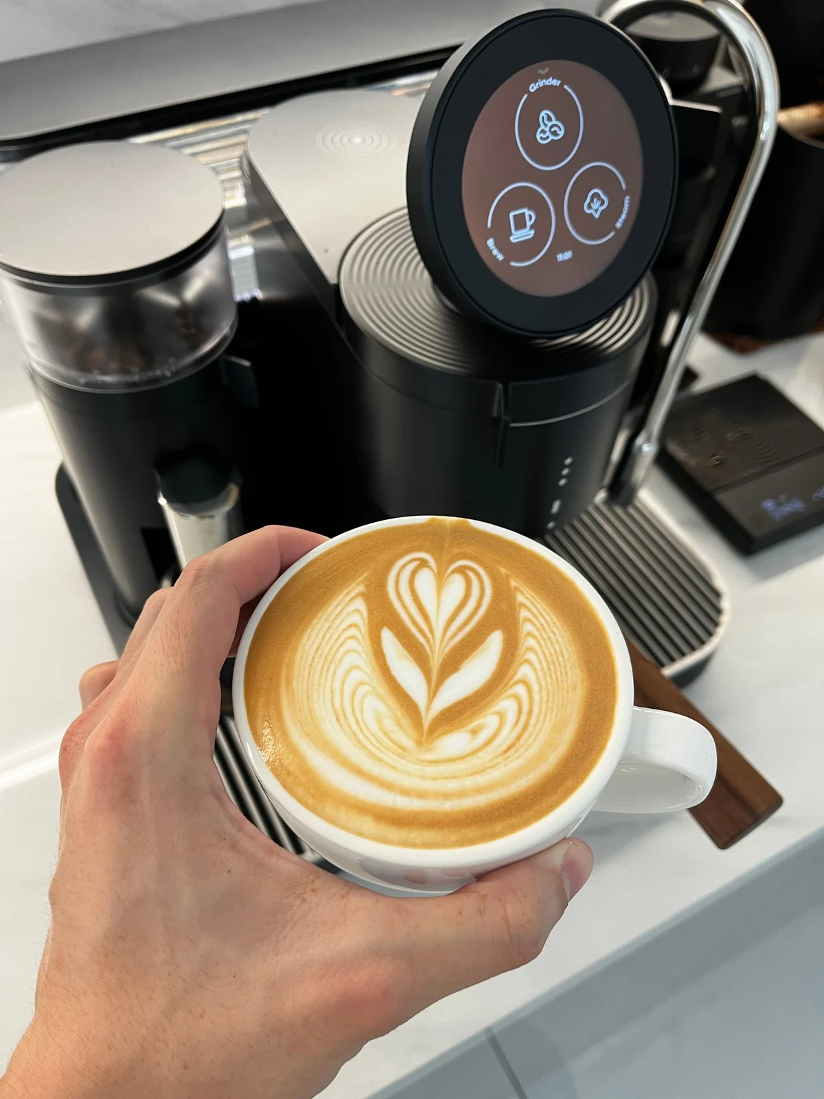 A finished latte made with the MERAKI espresso system.